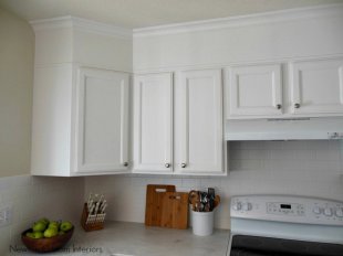 Kitchen cabinets painted white with soffits