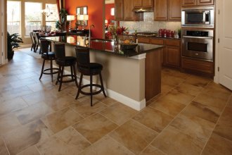 Photo features Oro Miele 18 x 18 in a brick-joint pattern on the floor.