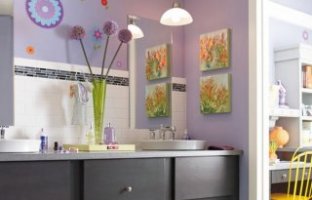 Purple kids' bathroom with ample color and attractive wall art