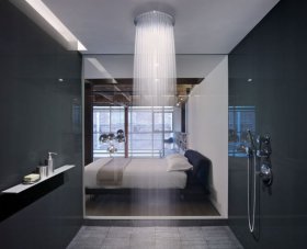 Water cascades from a large shower head